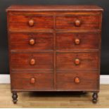An early Victorian mahogany chest, rectangular top above an arrangement of six drawers, bun handles,