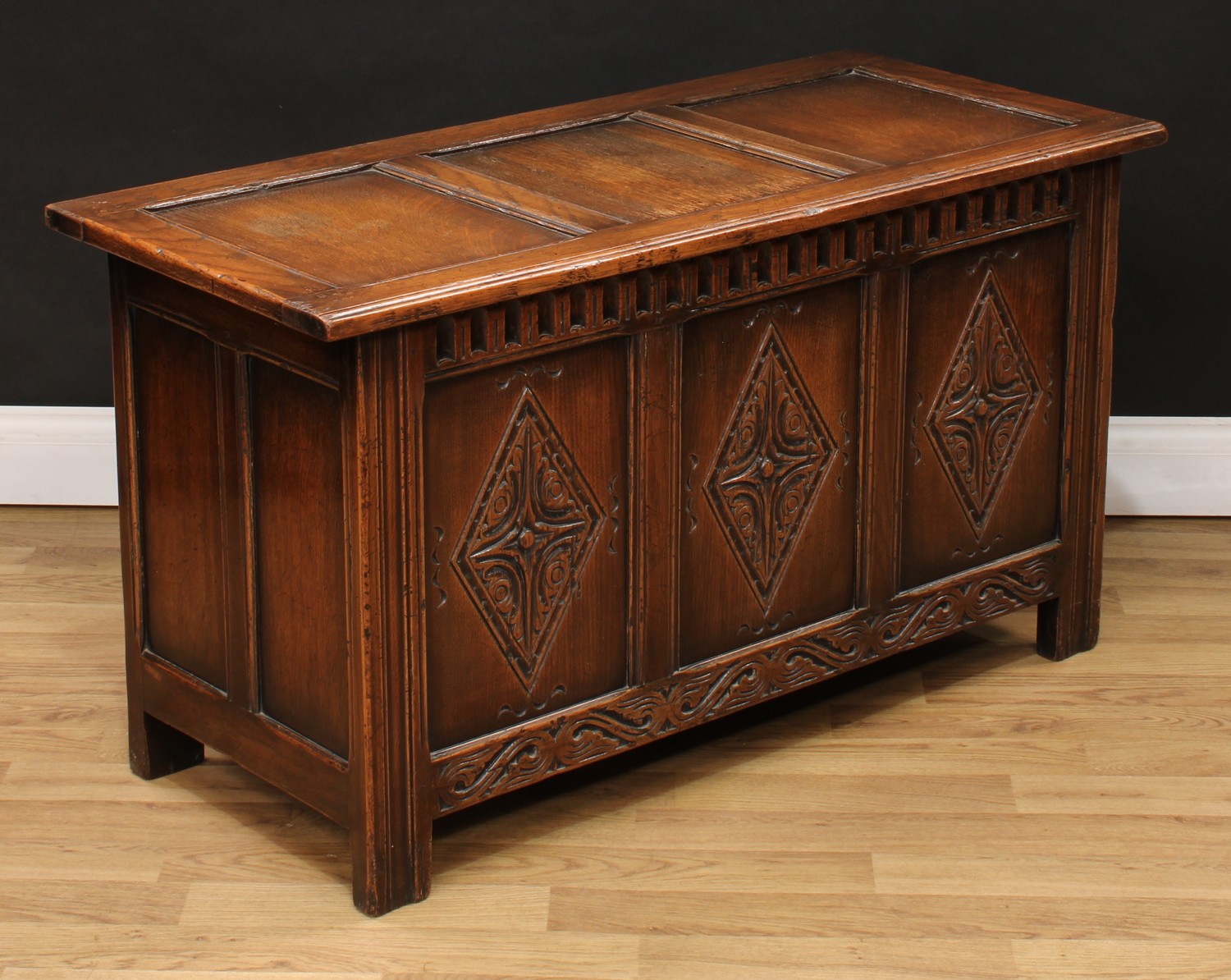 A 17th century style oak blanket chest, hinged top above a three panel front, nulled frieze, each - Image 2 of 3