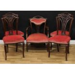 A late Victorian mahogany salon suite, comprising an armchair and four side chairs, the armchair