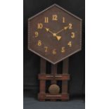 An Arts and Crafts oak wall clock, 81.5cm high, 42cm wide, c.1930