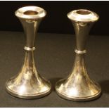 A pair of George V silver candlesticks, 15.5cm high, Birmingham 1918