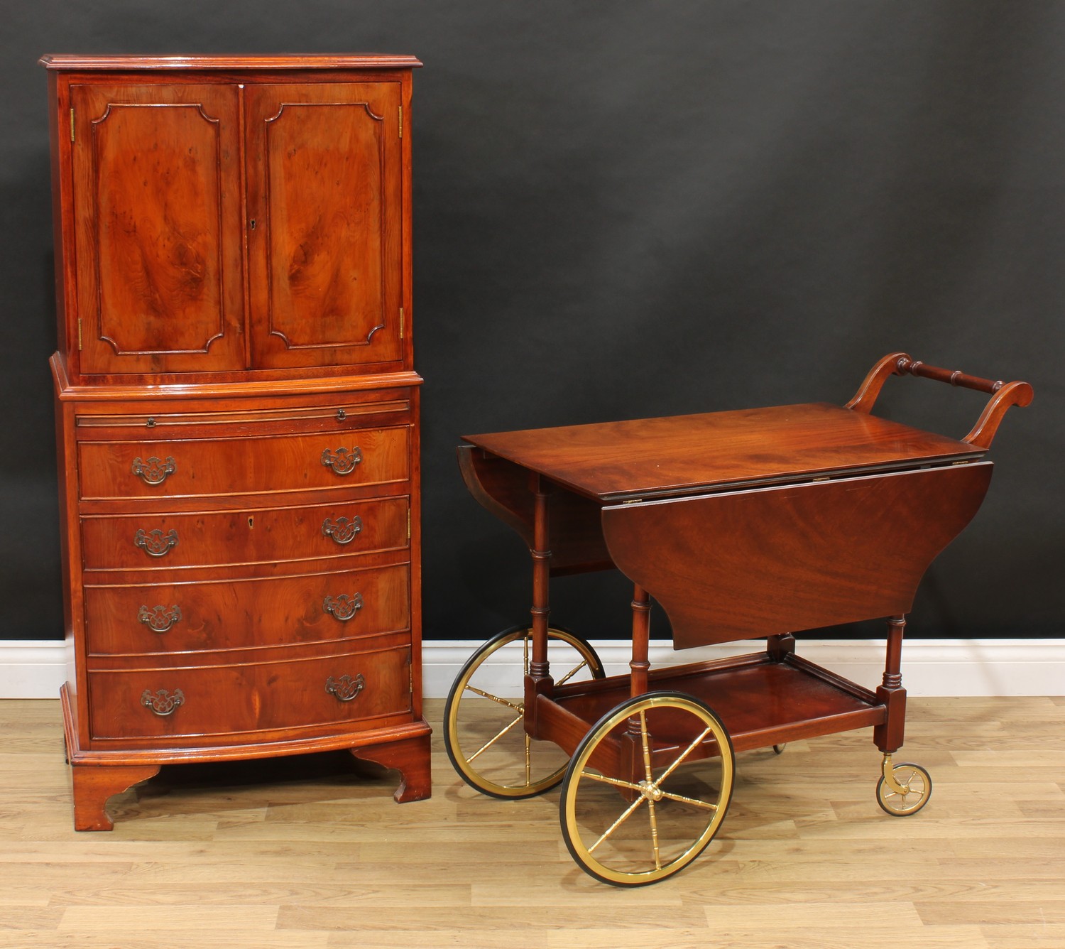 A George III style yew veneered drinks or cocktail cabinet, 129.5cm high, 61cm wide, 44.5cm deep;