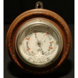 A Victorian walnut aneroid barometer, 12cm register inscribed J W Butler, Optician, Scarborough, the
