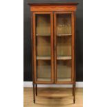 An Edwardian mahogany display cabinet, moulded cornice with shallow chequered parquetry apron