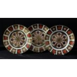 A set of three Royal Crown Derby Imari palette 1128 pattern side plates, 21.5cm, printed marks,