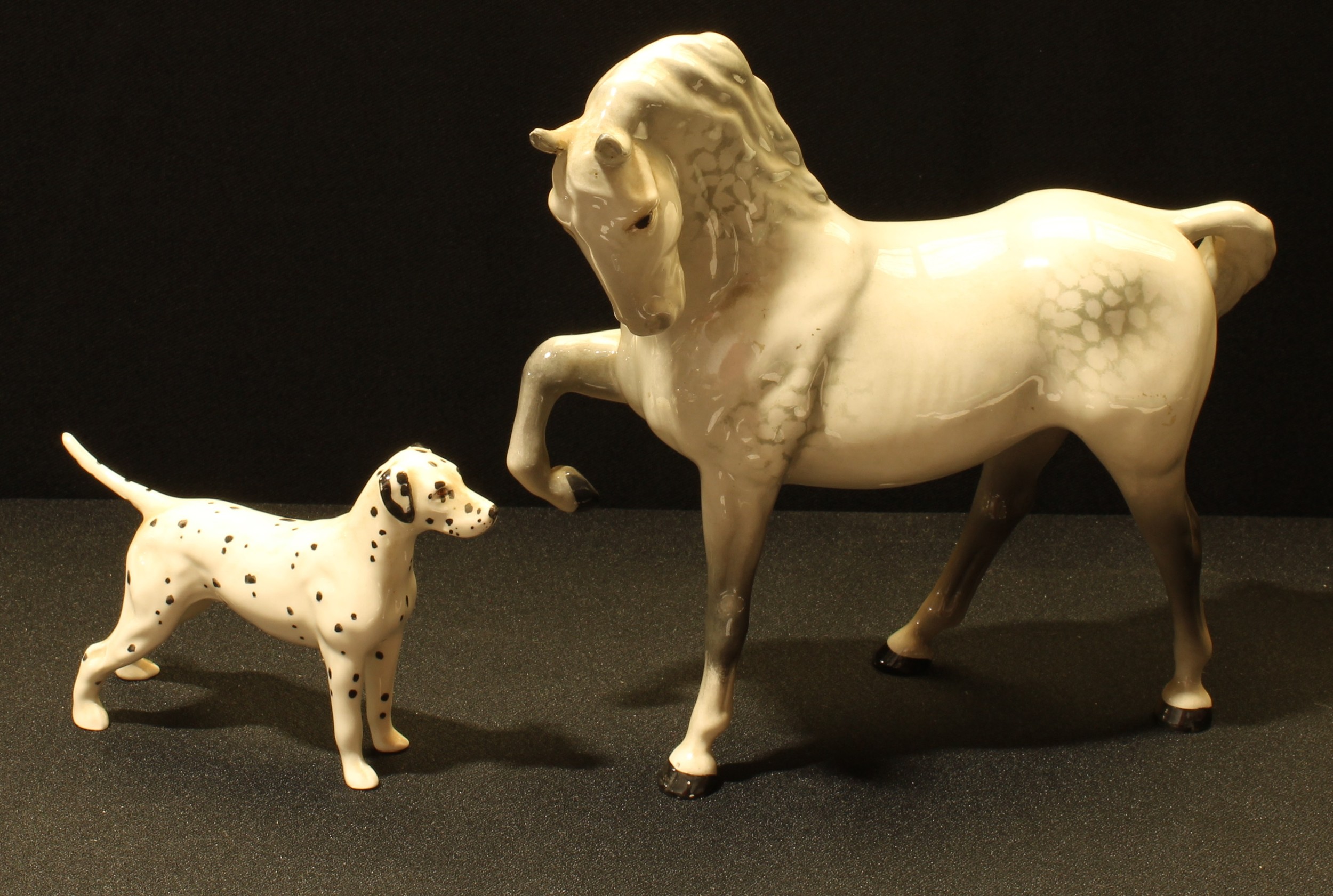 A Beswick Dappled Grey Horse, 19cm tall; a Beswick Dalmatian, 8.5cm tall, (2).
