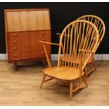 A pair of Ercol low armchairs, 94cm high, 75cm wide, the seat 40cm wide and 47cm deep; a retro mid-