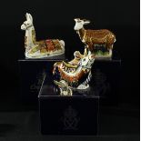 A Royal Crown Derby paperweight, Llama, signed, gold stopper, boxed; others, reindeer, signed,