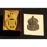 An On War service badge, 1915, original box; a hallmarked silver ARP badge, (2).