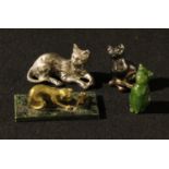 A Fininsh miniature brass model of a cat and mouse, 6cm wide; a jadeite miniature cat, 4cm; two