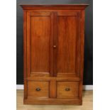 A '19th century' mahogany wardrobe, moulded cornice above a pair of panel doors enclosing a