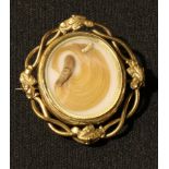 A 19th century mourning brooch, the mounted lock of hair set with seed pearls, 5.5cm long