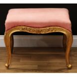 A 19th century Rococo Revival giltwood and gesso stool, stuffed-over serpentine seat, shaped apron
