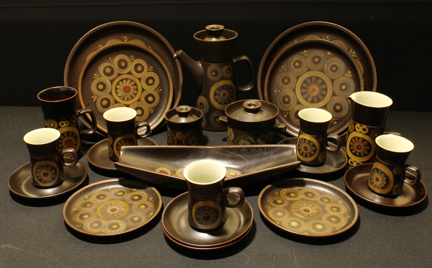 A Denby Arabesque pattern part dinner and coffee service, including dinner plates, cups and saucers,