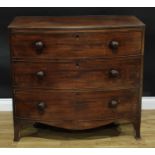 A George III mahogany bow-front chest, slightly oversailing top above three long graduated