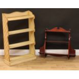 A painted open bookcase, 91cm high, 56cm wide, 19.5cm deep; a wall hanging three-tier shelf, 56.