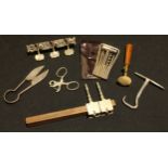 A cased travelling tool kit; a pair of miniature topiary shears, leather workers hole punch, other