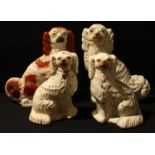 A pair of Victorian Staffordshire mantel dogs; two others (4)