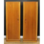 A pair of oak and teak wardrobes, originally retailed by Hunters of Derby, 175.5cm high, 61cm