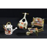 A Royal Crown Derby Imari palette miniature model of a garden bench, 8.5cm wide, printed mark,