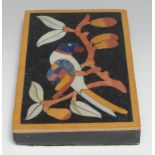 A large pietra dura rectangular desk weight, inlaid in lapis lazuli and specimen stones with a