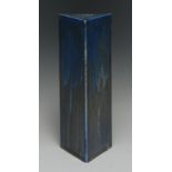 A Ruskin matt crystalline triangular prism shaped lamp base, in mottled blue and ochre, 25cm high,