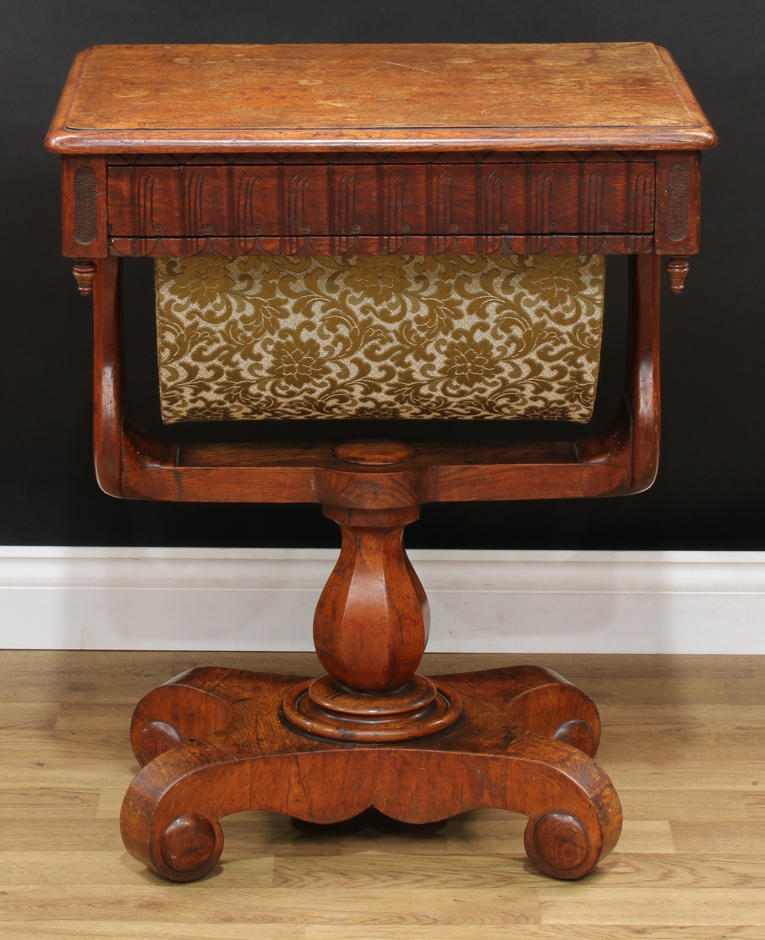 A Victorian oak work table, rounded rectangular top with moulded edge above a frieze drawer and