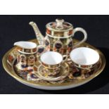 A Royal Crown Derby 1128 pattern miniature tea set on tray