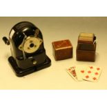 A set of patience cards in a leather box; a Bakelite desk top pencil sharpener (2)