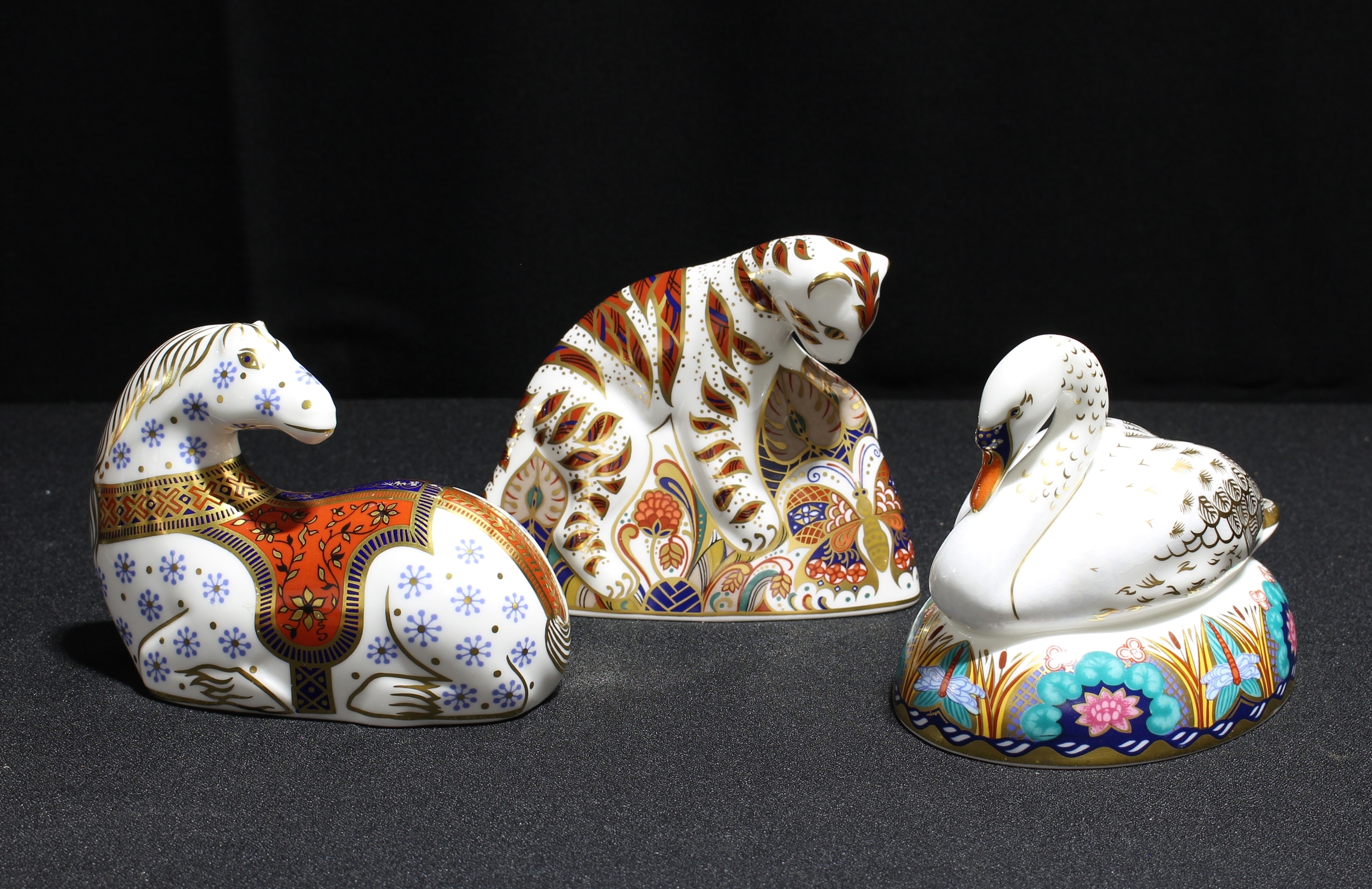A Royal Crown Derby paperweight, Baby Bengal Tiger, silver stopper; others, Swan, Horse, silver