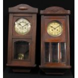 An early 20th century oak wall clock, 72cm high, c.1935; another, similar (2)