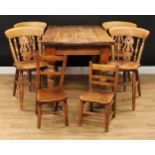 A pine farmhouse dining table, 78cm high, 122cm long, 75cm deep; a set of four dining chairs, 85cm