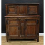 An '18th century' oak duodarn or court cupboard, rectangular top with moulded edge above two panel