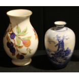 A Royal Worcester Evesham vase, 20.5cm high; a Delft blue and white vase, marked Delph 29/2956,