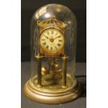 An early 20th century lacquered brass perpetual clock, glass dome, c.1900