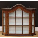 An 18th century style Dutch wall hanging display cabinet, arched top above an astragal glazed door