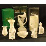 A Belleek Dragonfly pattern vase, 18cm, printed mark, boxed; others similar, a Harp, boxed; cats,