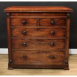 An early Victorian mahogany chest, crossbanded rectangular top above a concealed frieze drawer,