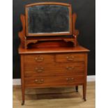 An Edwardian mahogany dressing chest, arched mirror, two short above two long drawers, outlined