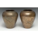 A pair of Japanese patinated bronze inverted baluster vases, cast and chased relief with pairs of