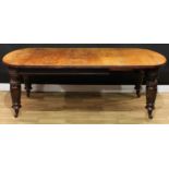A Victorian oak extending dining table, discorectangular top with moulded edge and one additional
