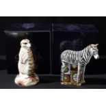 A Royal Crown Derby paperweight, Meerkat, gold stopper, boxed; another, Baby Zebra, gold stopper,