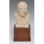 A plaster desk bust, of Sir Winston Churchill, mahogany base, 20cm high