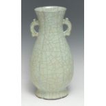 A Chinese fluted ovoid crackle glazed celadon vase, shaped loop handles, 29cm high