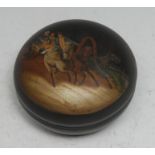 A Russian lacquer circular box and cover, decorated in polychrome with an open trap drawn by three