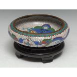 A Chinese cloisonne enamel circular bowl, decorated in polychrome with dragons amongst scrolling