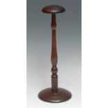 Treen - a turned mahogany wig stand, stepped circular base, 31cm high