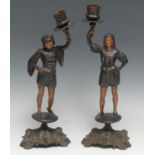 A pair of late 19th century French cast iron figural candlesticks, each as a man in Renaissance