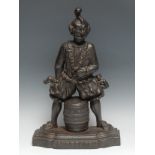 A 19th century cast iron door stop, cast as a jester astride a barrel and inscribed Old Tom, Dont