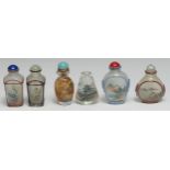 A Chinese inside painted glass ovoid snuff bottle, decorated with a monumental landscape and